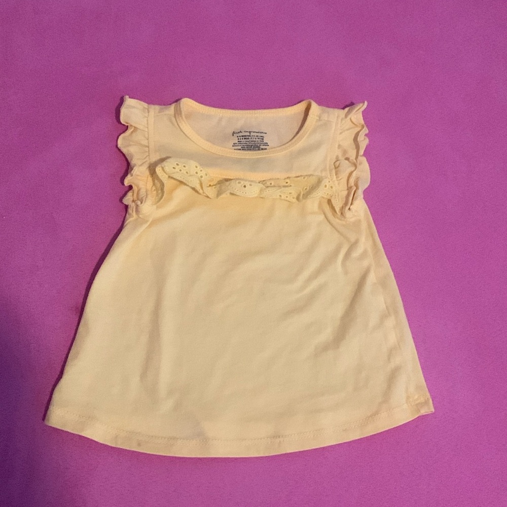 First impressions sleeveless top